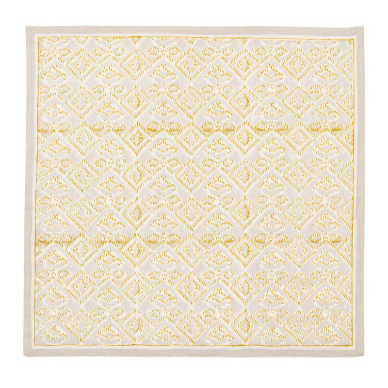Unfolded Alfresco natural and gray cotton napkin showing traditional Indian block print