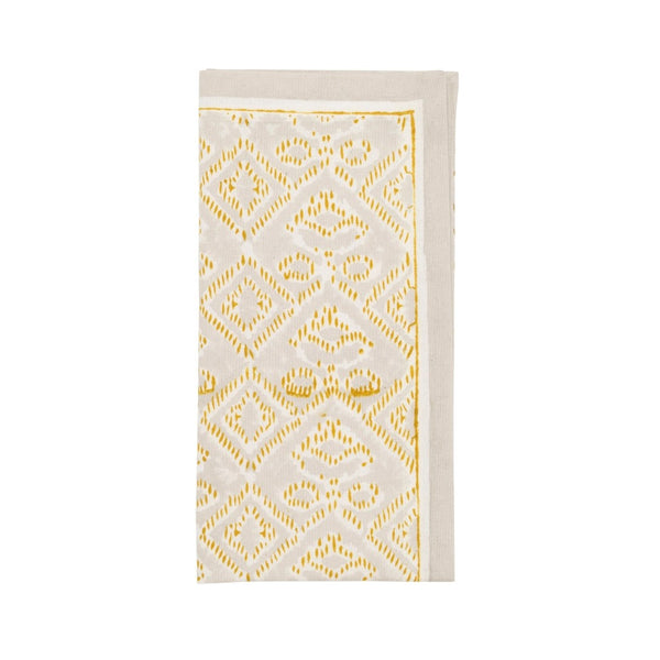Folded Alfresco natural and gray cotton napkin with Indian block print on white background 