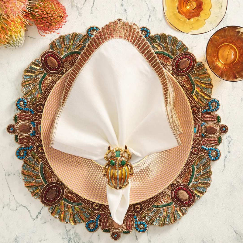 Nile napkin styled with a bronze-accented placemat on an earthy, egyptian themed table setting