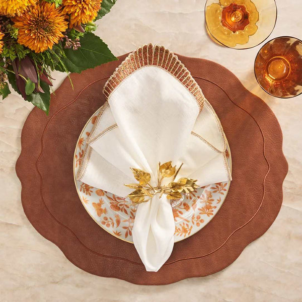 Kim Seybert Nile napkin on an elegant table with bronze and linen textures, featured by Amiramour