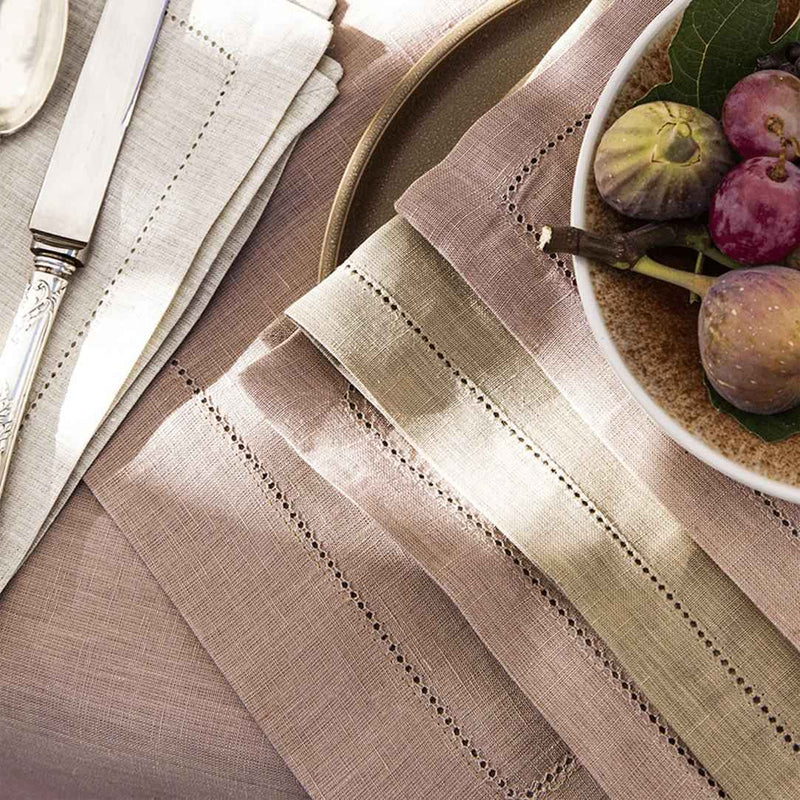 Close-up hemstitch border of the blush pink linen napkin by Alexandre Turpault.