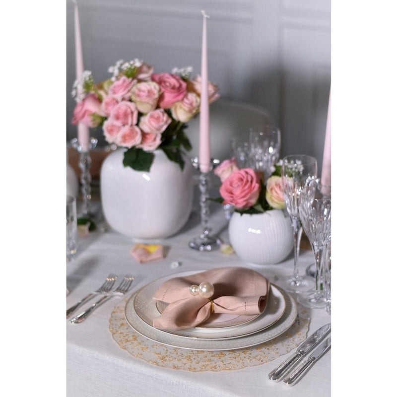 Blush pink linen napkin styled on elegant table setting, sold at Amiramour.
