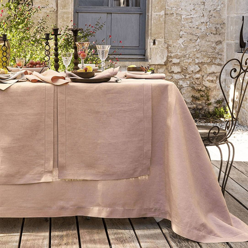 Blush pink linen napkin by Alexandre Turpault styled with matching runner and tablecloth.