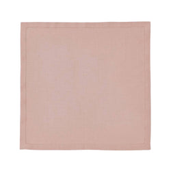 Blush pink linen napkin with hemstitch border by Alexandre Turpault on white background.