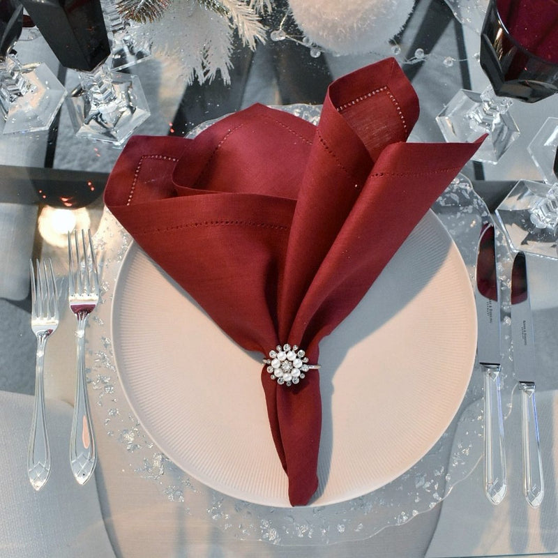 Red  linen napkin with stain-resistant Teflon coating syled with silver napkin ring.