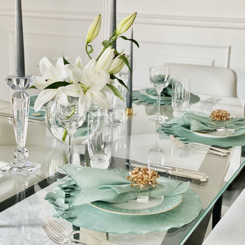 Garza linen gauze napkin in sage green styled on elegant tablesetting with flowers, sold at Amiramour.
