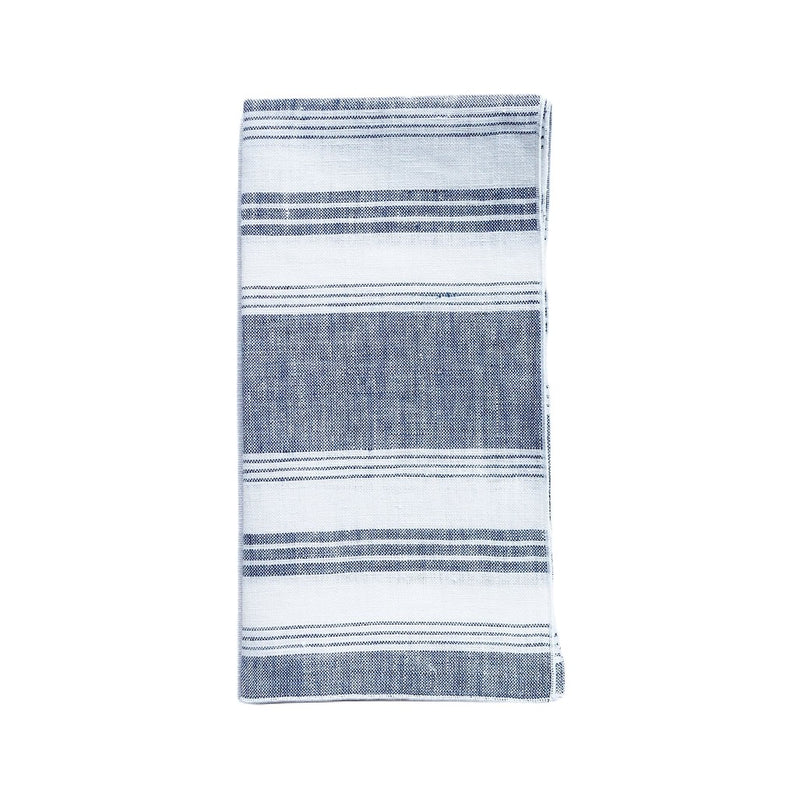 Folded Riva blue and white striped linen napkin styled on white background, sold at Amiramour.