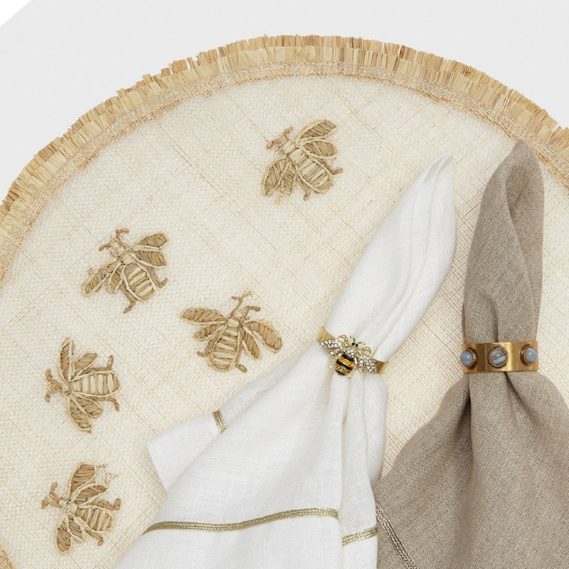 Gold Trim Linen Napkin In White by Joanna Buchanan styled with bee motif napkin ring