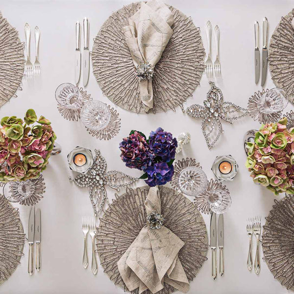 Styled table elegant table setting with silver accents featuring variegated linen napkin 