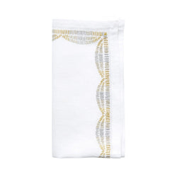 Patina linen napkin by Kim Seybert folded on white background