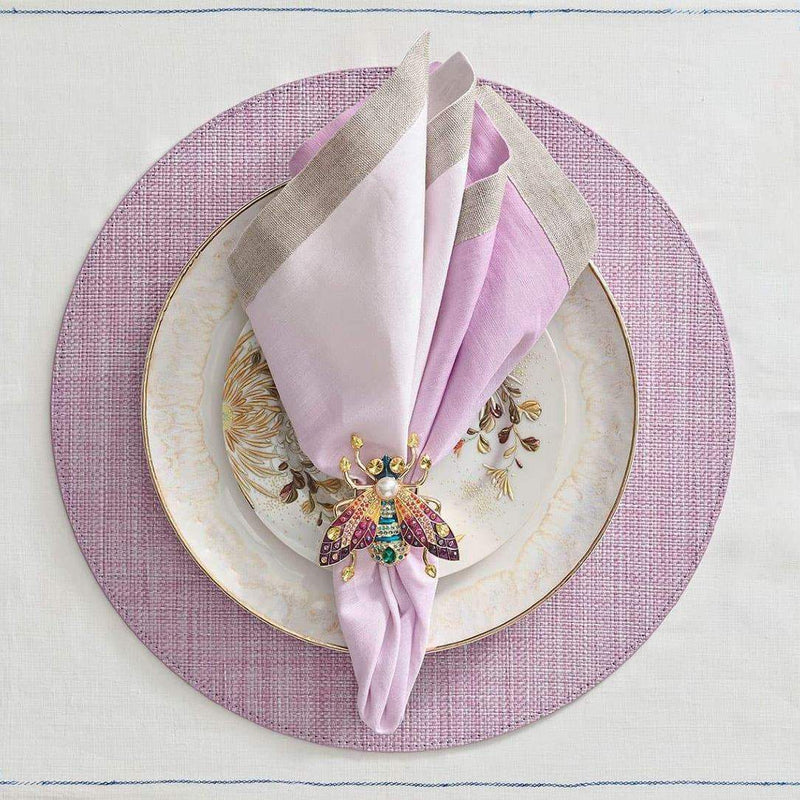 Lilac ombre linen napkin styled on purple placemat.