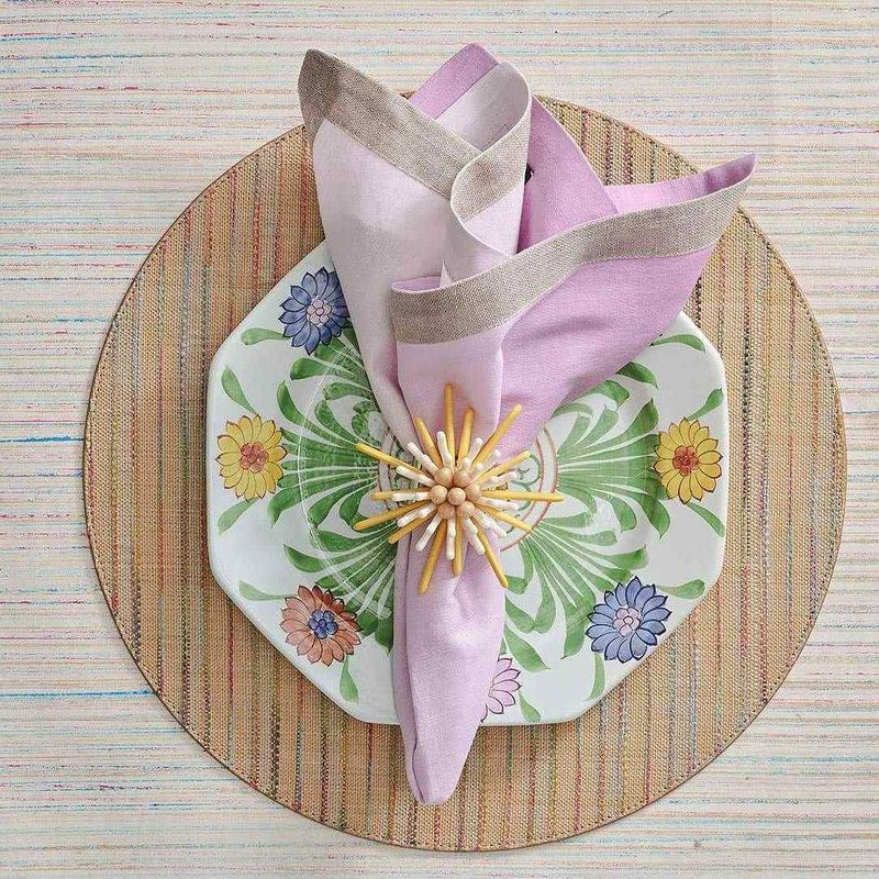 Lilac ombre linen napkin styled on rattan placemat.