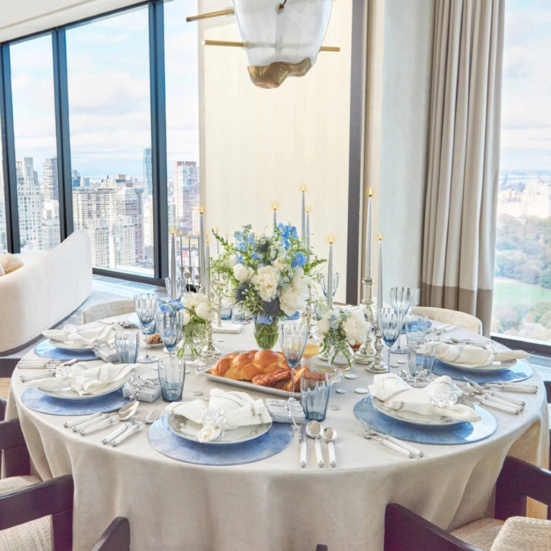 Elegant dining table featuring Kim Seybert Cloud Napkin Rings available at Amiramour