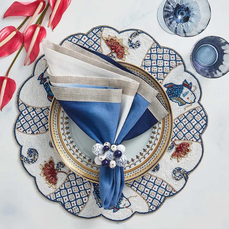 Coastal beach-inspired dining setup with white and blue Cloud Napkin Rings