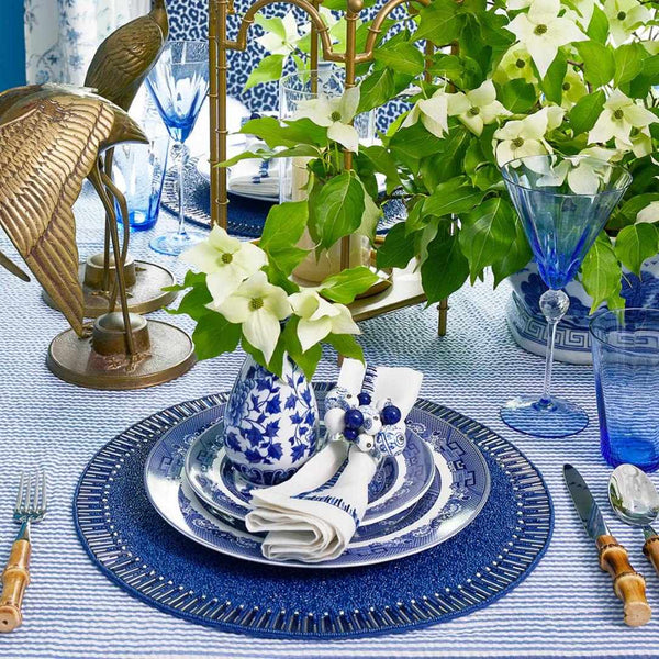Close-up of Greek Mediterranean style table featuring Cloud Napkin Rings in blue and white
