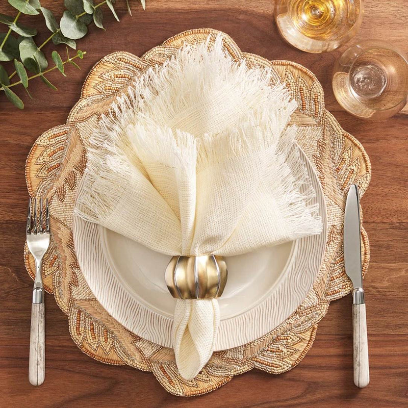 Light cream-toned table setting with Desert Napkin Ring by Kim Seybert