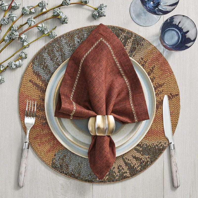 Bronze and terracotta luxury table featuring Desert Napkin Ring by Kim Seybert