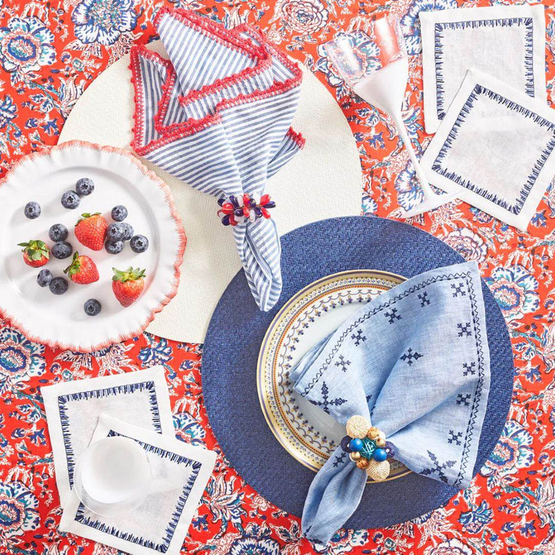 Light blue napkin with Java Napkin Ring by Kim Seybert in a mixed product setting
