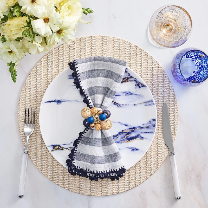 Beach-style table with Java Napkin Ring in navy, white, and natural tones