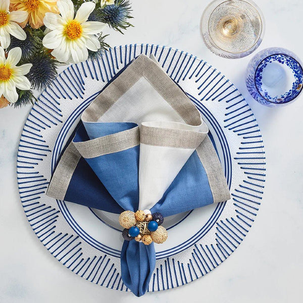 Elegant cream and blue table setting with Java Napkin Ring by Kim Seybert