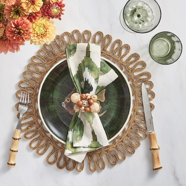 Overhead shot of beach-themed table in green tones with Java Napkin Ring