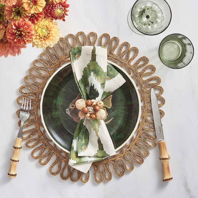 Overhead shot of beach-themed table in green tones with Java Napkin Ring