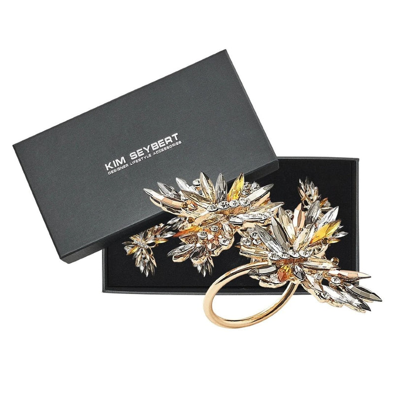 Close-up of the  butterfly napkin ring in champagne with crystal rhinestones by Kim Seybert in a Gift Box
