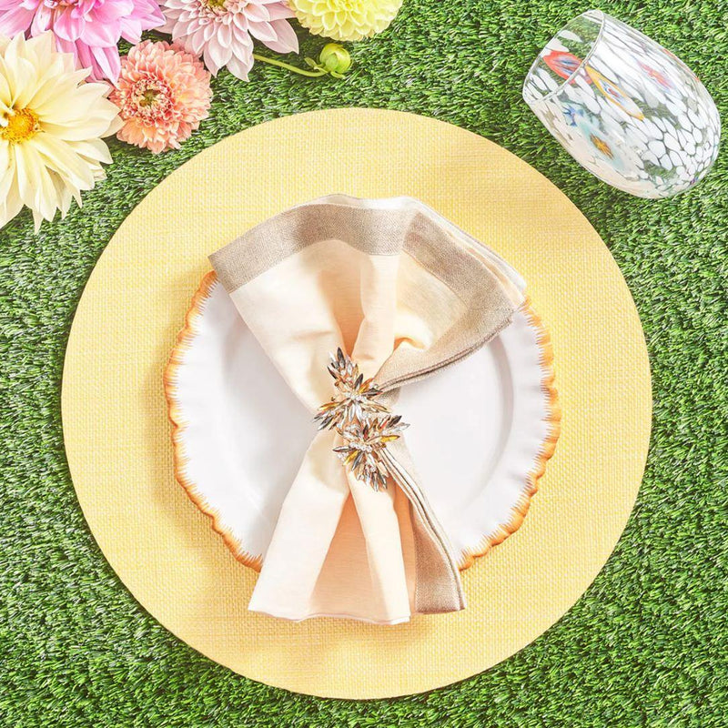 Peach, cream, and caramel-toned table setting with crystal butterfly napkin ring by Kim Seybert