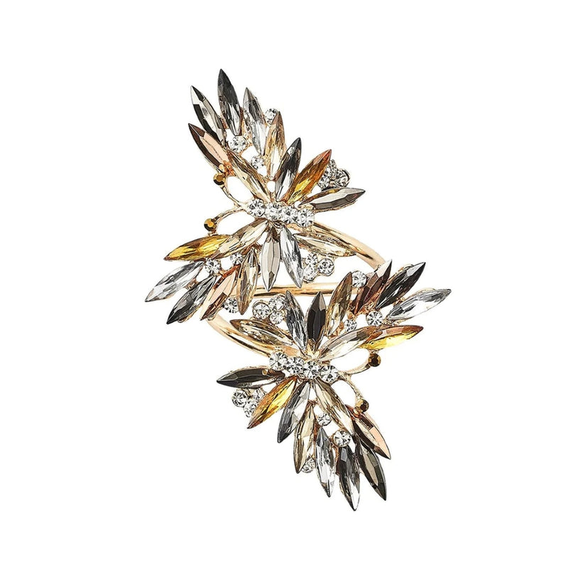 Top view of layered butterfly napkin ring in champagne metal with gems and rhinestones by Kim Seybert