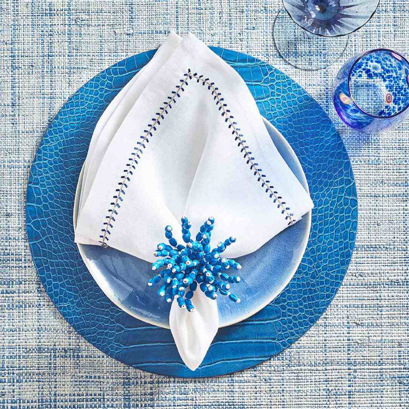 Coastal-themed table arrangement in blue and white featuring Reed Napkin Ring
