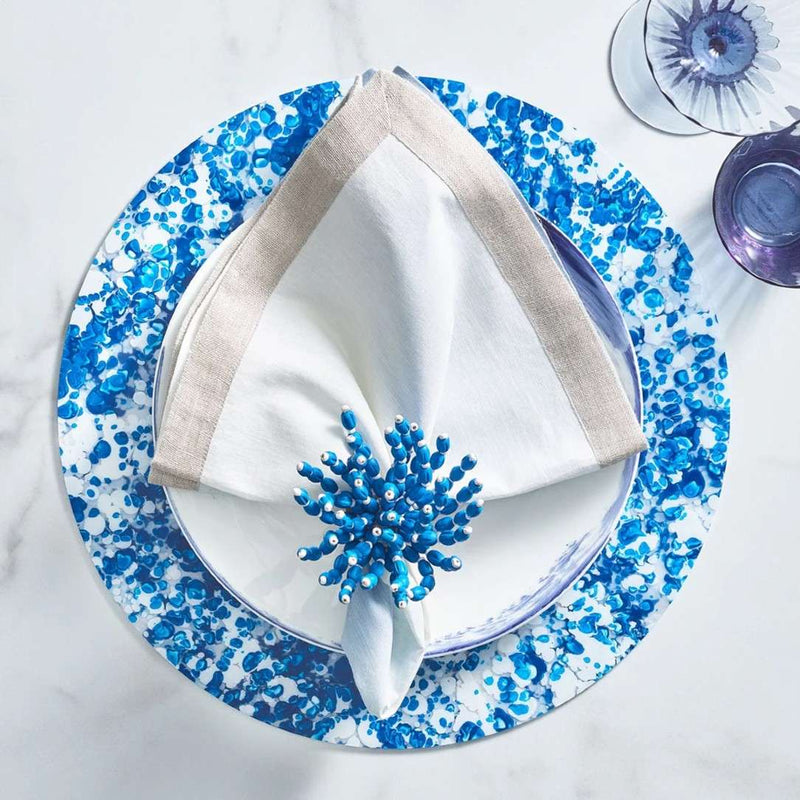 Blue, white, and beige summer table setting with Reed Napkin Ring by Kim Seybert