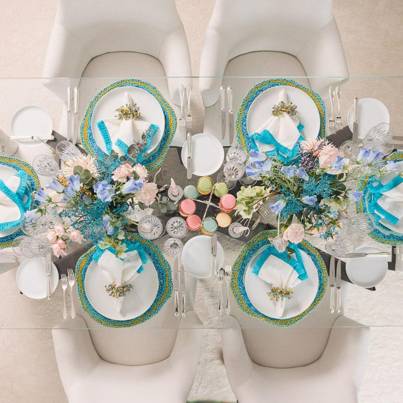 Overhead view of spring table with Spritz Napkin Rings in sorbet hues by Kim Seybert