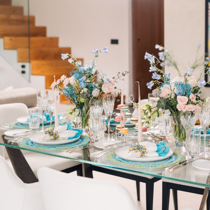 Full spring table arrangement with Spritz Napkin Rings by Kim Seybert in white and turquoise
