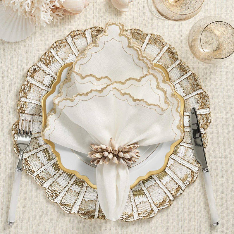 Elegant coastal table with seashell elements and Shell Fringe Napkin Ring by Kim Seybert