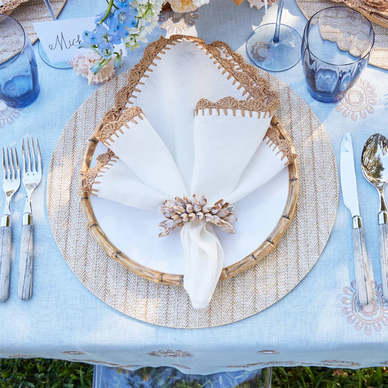 Overhead view of beach-themed table with Shell Fringe Napkin Ring