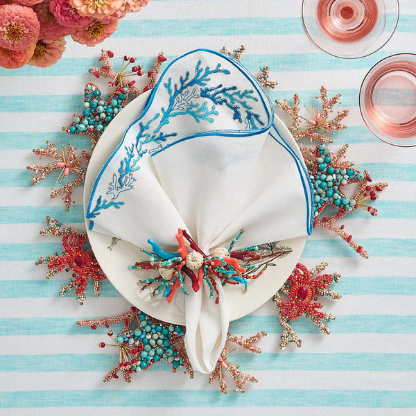Coastal summer table with Coral Spray Napkin Ring by Kim Seybert in turquoise and coral hues