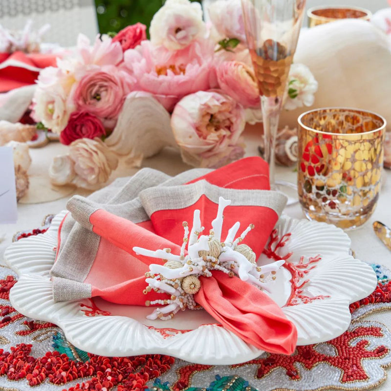 Coral red and rose tones table decor featuring Coral Spray Napkin Ring in White and Natural by Kim Seybert