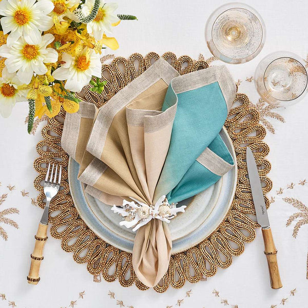 Luxury table setting with Coral Spray Napkin Ring by Kim Seybert in nude and turquoise