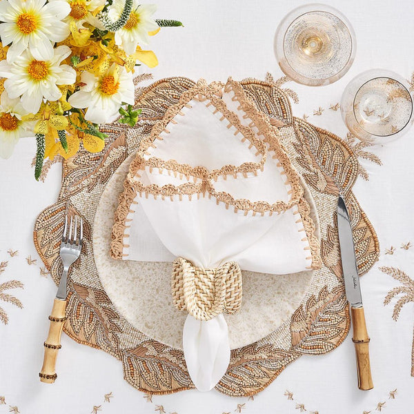 Beach-style table in sandy tones with Ruffle Rattan Napkin Ring by Kim Seybert