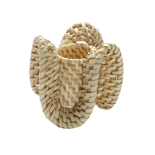 Side view of handwoven natural rattan Ruffle Napkin Ring by Kim Seybert
