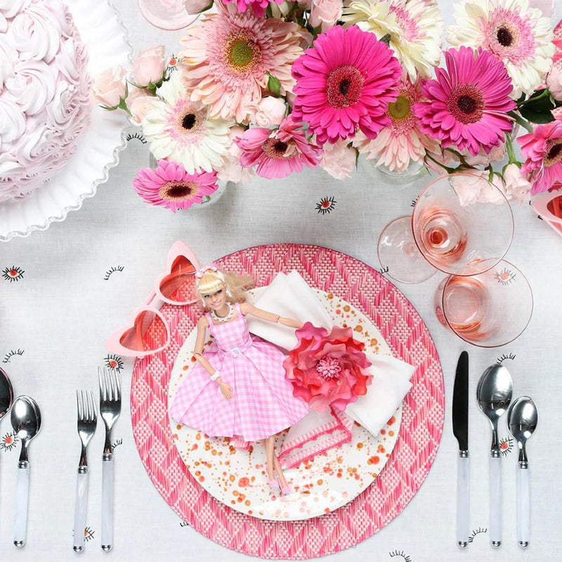 Gardenia Napkin Ring by Kim Seybert featured in a vibrant, Barbie-inspired table setting with playful pink and orange tones