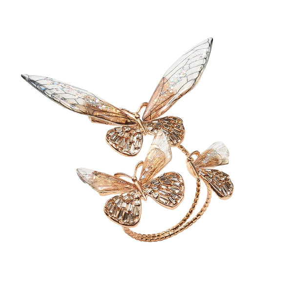 Front view of Flutter Napkin Ring in champagne and gold with rhinestone butterfly wings by Kim Seybert