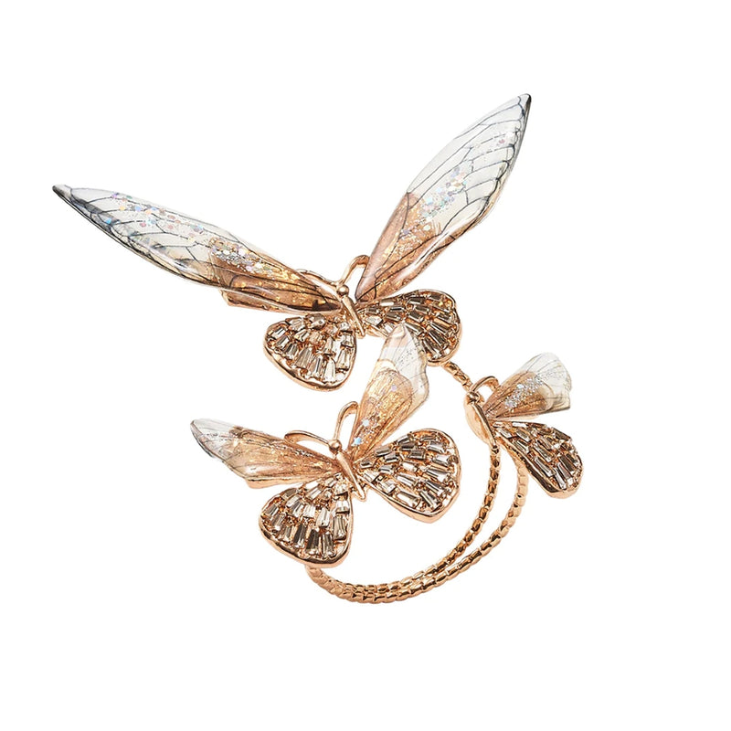 Front view of Flutter Napkin Ring in champagne and gold with rhinestone butterfly wings by Kim Seybert