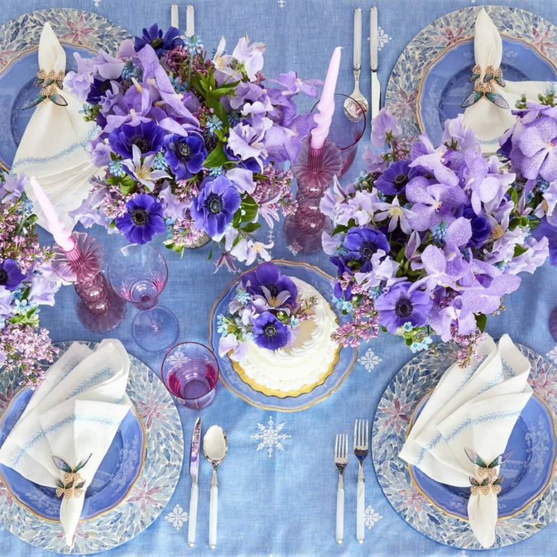 Overhead view of spring tablescape with lilac tones and Kim Seybert Flutter Napkin Rings