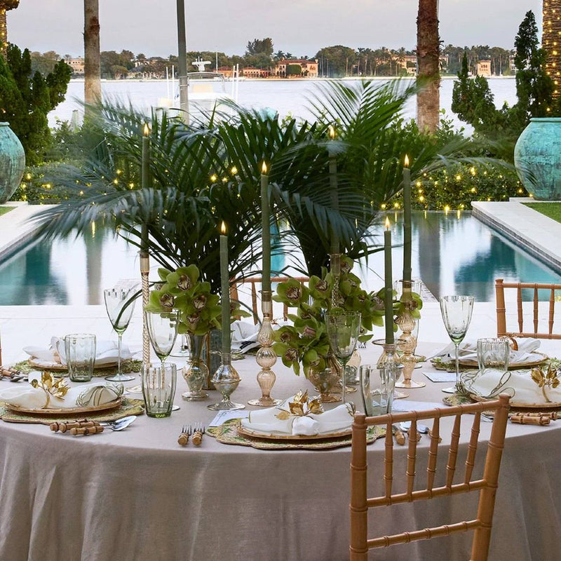 Luxurious green table with Bougainvillea Napkin Ring in gold by Kim Seybert