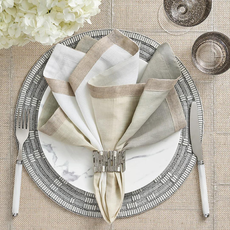 Elegant table setting with Kim Seybert’s Matrix napkin ring featuring mother-of-pearl shimmer