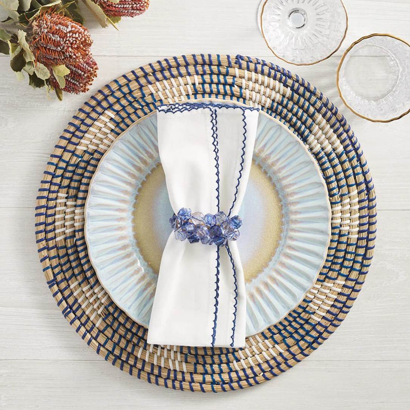 Natural and navy-themed table arrangement with Pop Rocks napkin rings