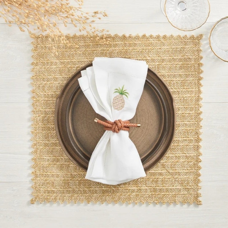 Beige and brown-toned table with Rope Knot Napkin Ring by Kim Seybert