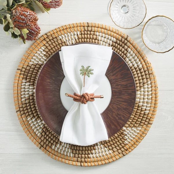 Elegant coastal setting in soft earth tones with Rope Knot Napkin Ring by Kim Seybert
