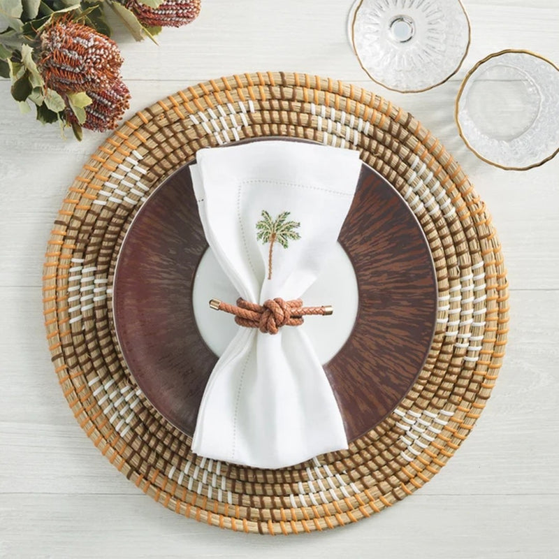 Elegant coastal setting in soft earth tones with Rope Knot Napkin Ring by Kim Seybert